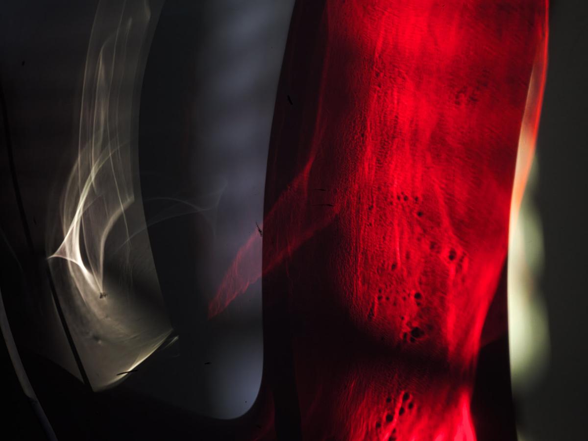 Abstract light pattern in red and white.