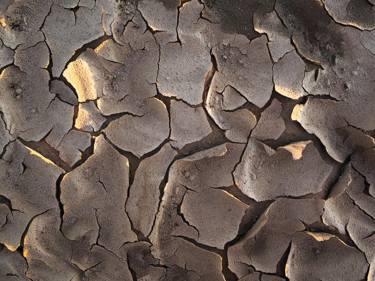 Broken and crumpled crust of dried sand